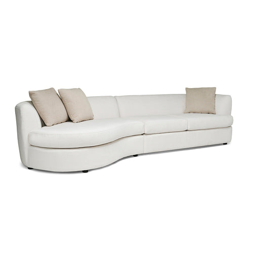 White curved sofa with beige cushions on a white background