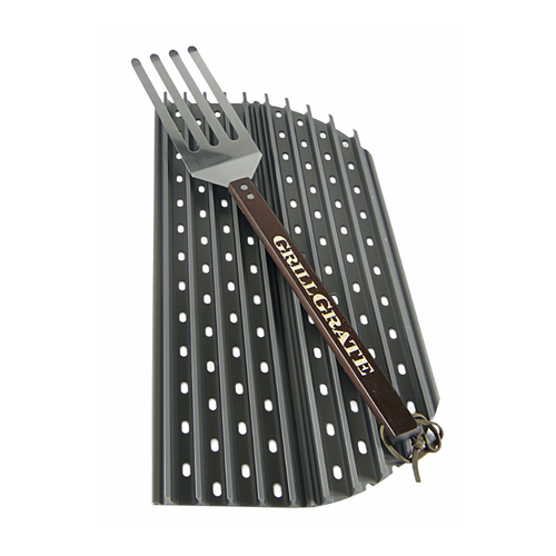 Grill grate with fork on a white background