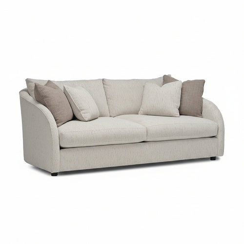 Gray sofa with beige cushions on a white background